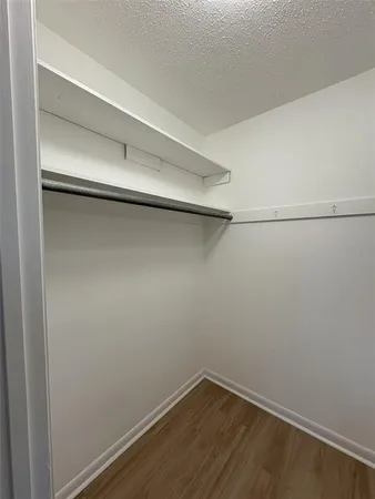 a bathroom with a toilet and a mirror