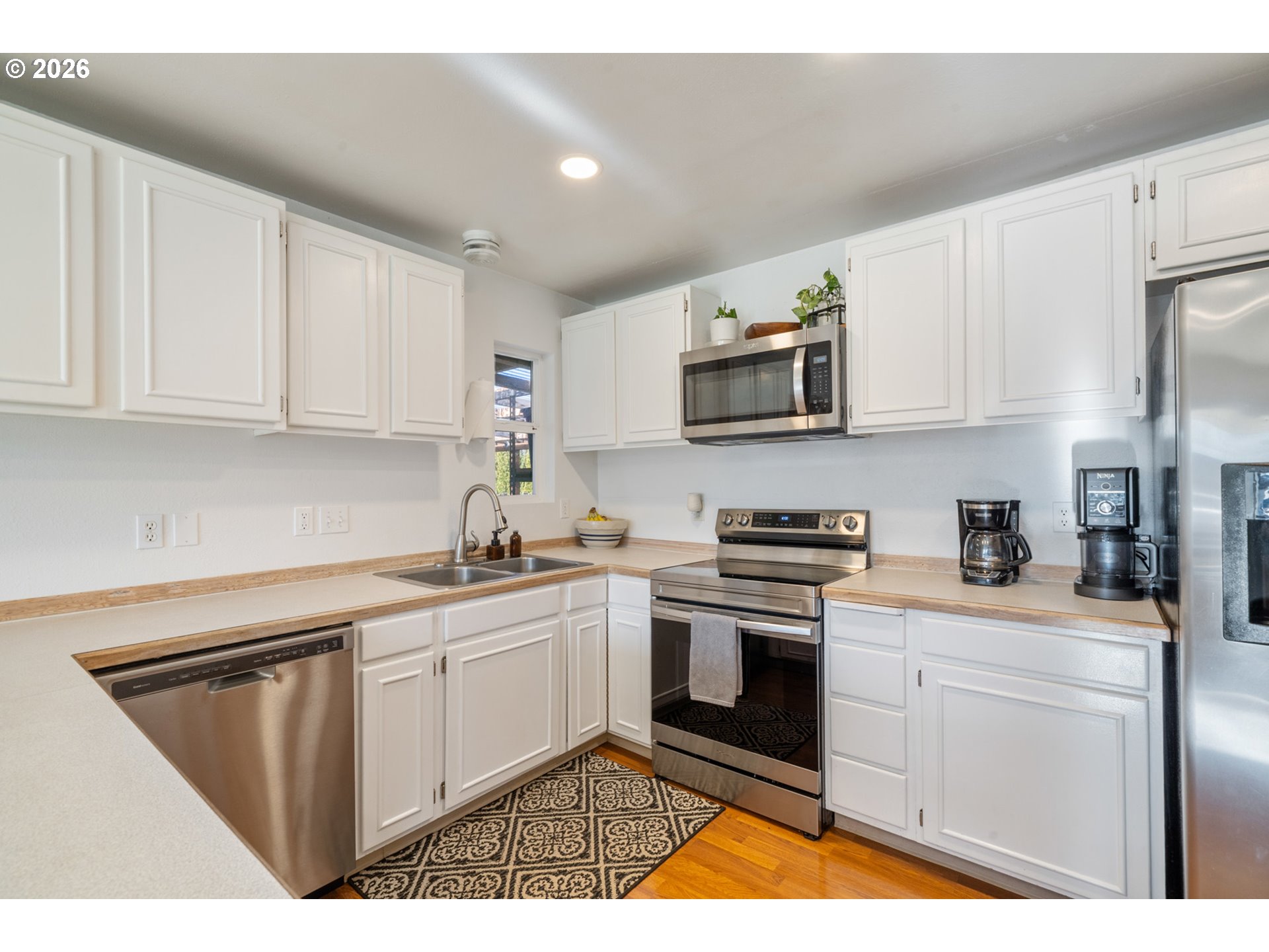 3500 Hawthorne Lane Tillamook, OR 97141 - Photo 11 of 35 a kitchen with stainless steel appliances granite countertop a sink stove and microwave