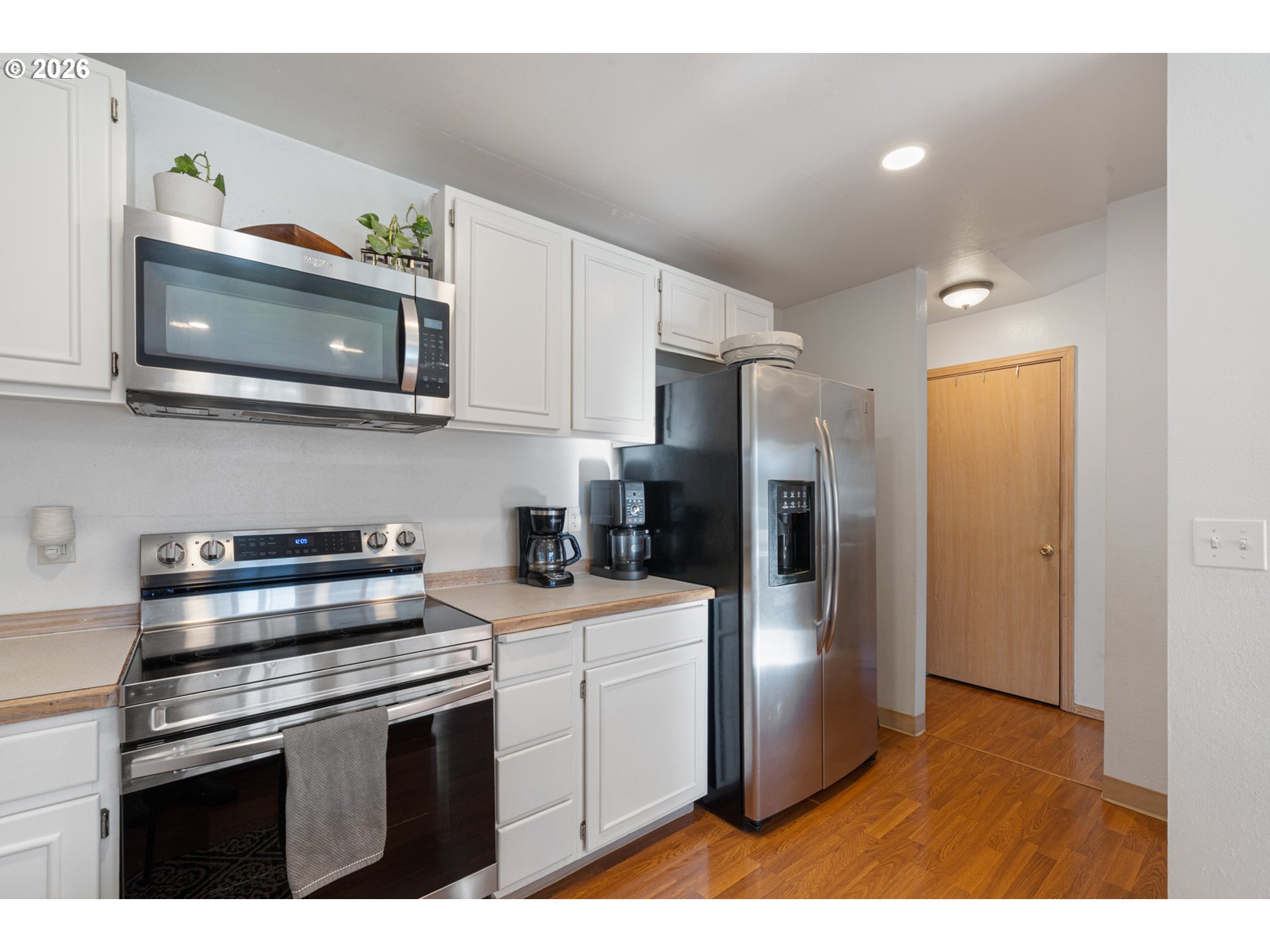 3500 Hawthorne Lane Tillamook, OR 97141 - Photo 13 of 35 a kitchen with stainless steel appliances a stove microwave and a sink
