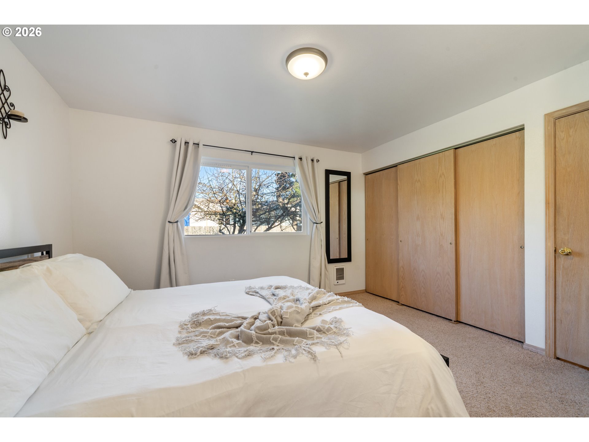 3500 Hawthorne Lane Tillamook, OR 97141 - Photo 24 of 35 a bedroom with a large bed and a window