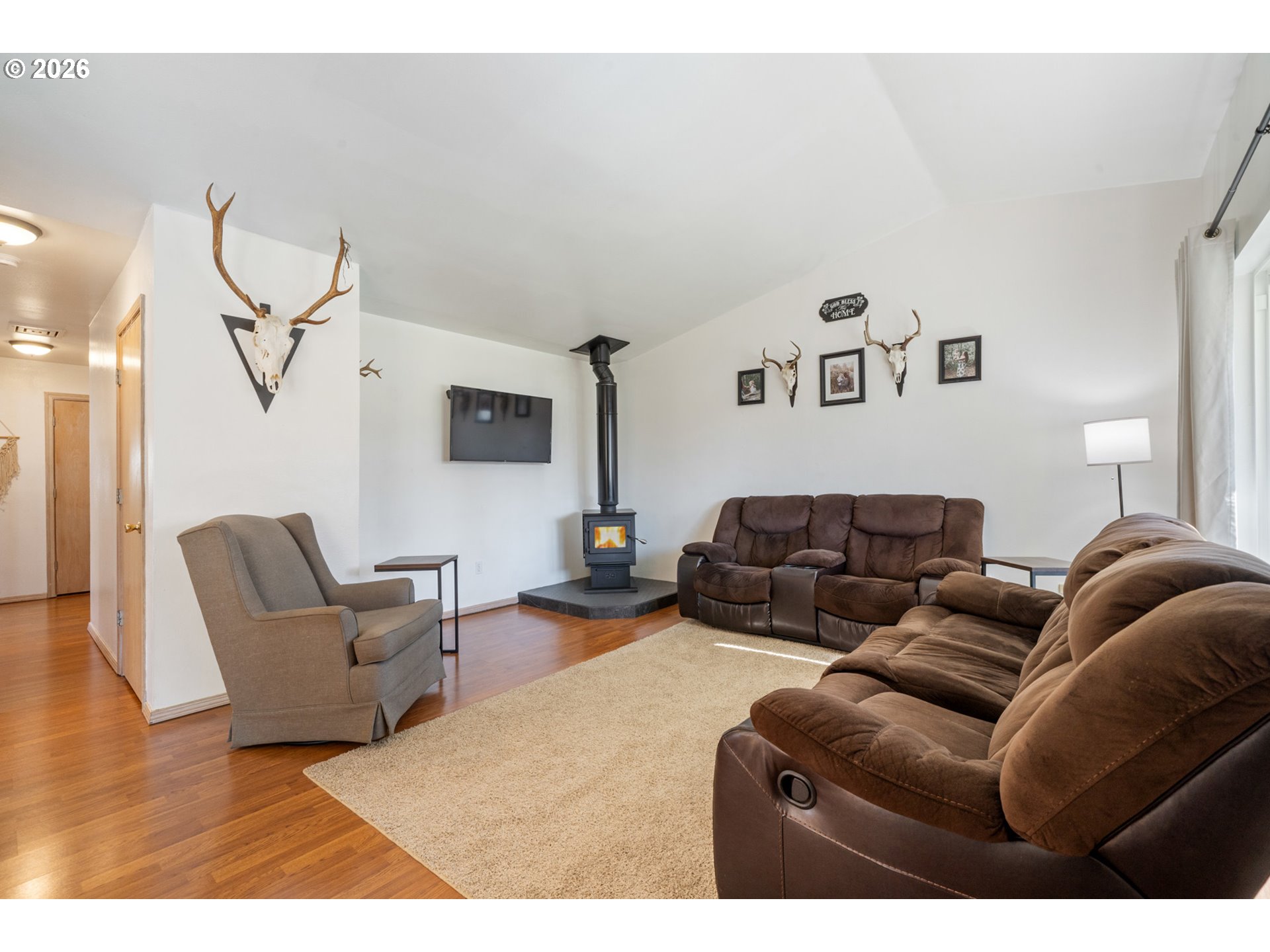 3500 Hawthorne Lane Tillamook, OR 97141 - Photo 3 of 35 a living room with furniture and a flat screen tv