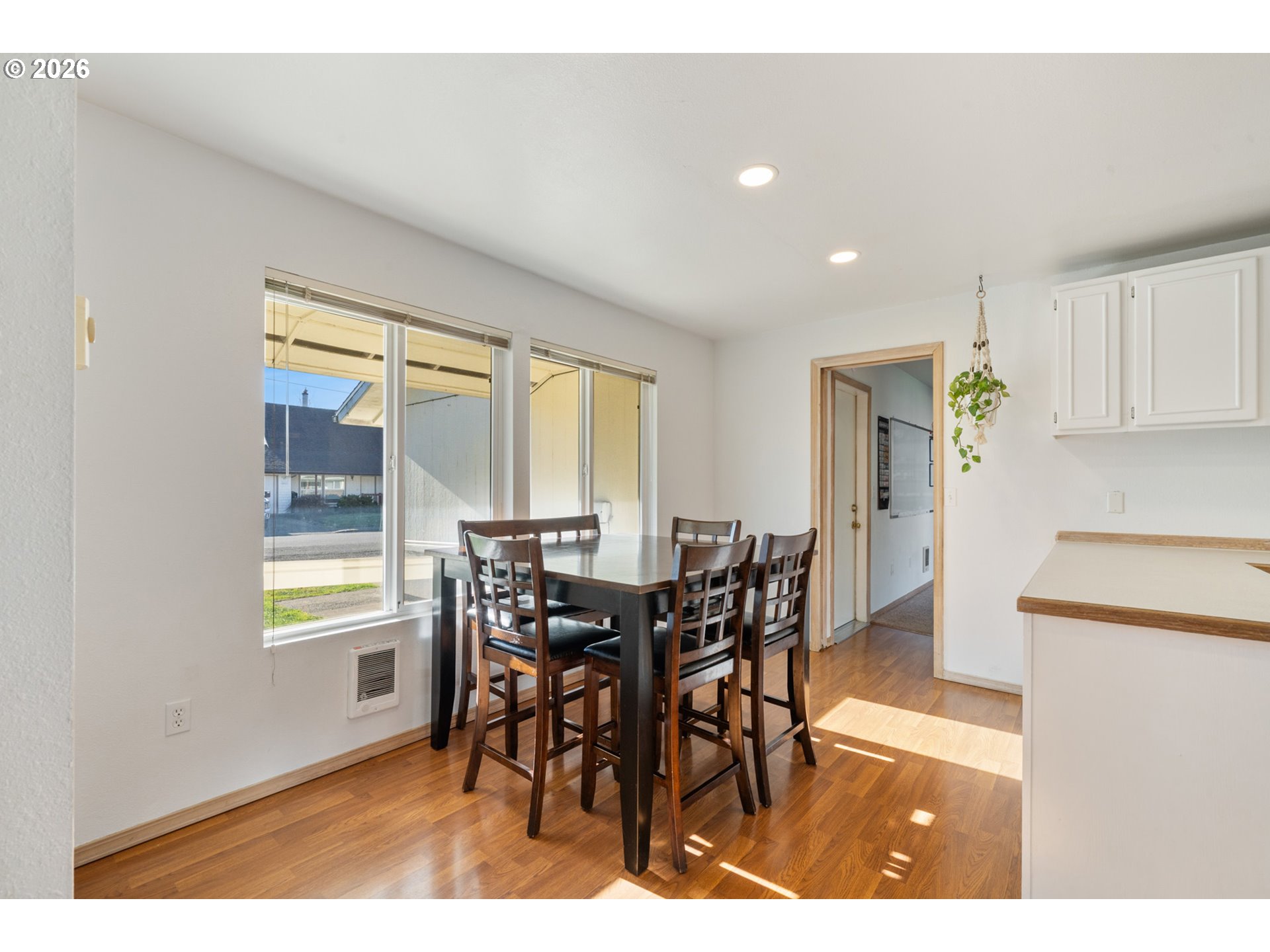 3500 Hawthorne Lane Tillamook, OR 97141 - Photo 7 of 35 a view of a dining room with furniture and wooden floor