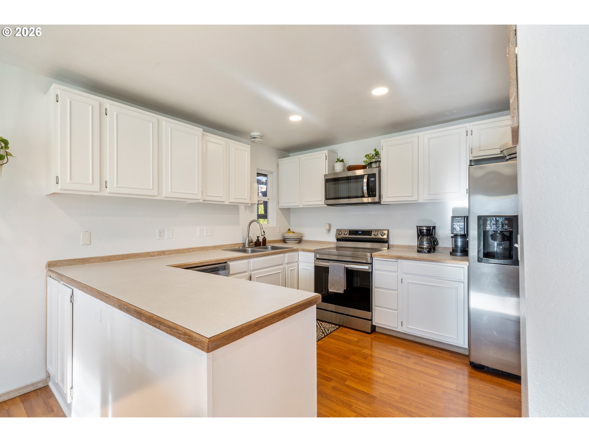 3500 Hawthorne Lane Tillamook, OR 97141 - Photo 9 of 35 a kitchen with a stove a sink and a refrigerator