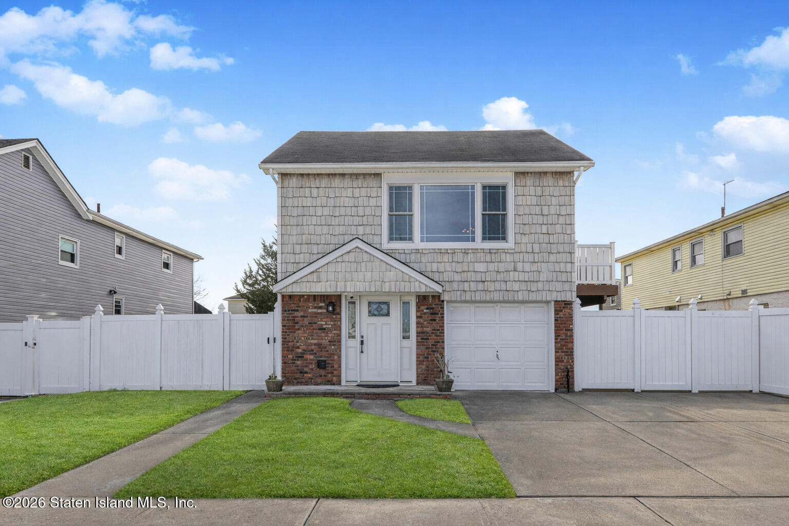 76 Berry Avenue Staten Island, NY 10312 - Photo 1 of 42 a front view of a house with a yard
