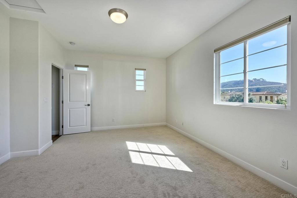 7127 Sitio Caliente Carlsbad, CA 92009 - Photo 17 of 24 an empty room with windows