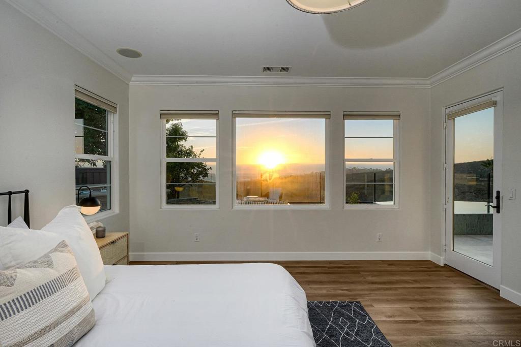7127 Sitio Caliente Carlsbad, CA 92009 - Photo 6 of 24 a bedroom with a bed and a window