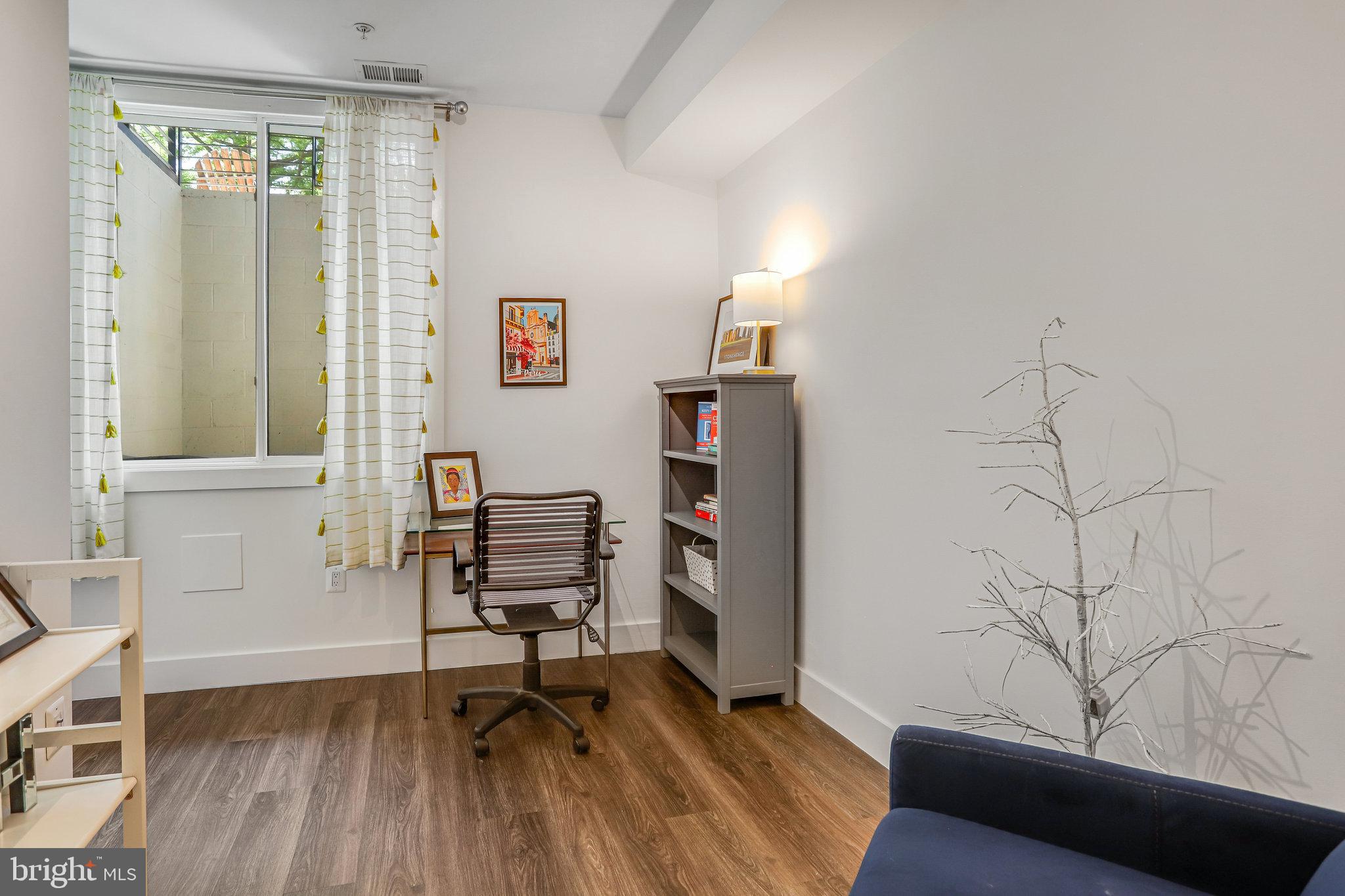 308 U Street Northeast, Unit 1 Washington, DC 20002 - Photo 15 of 25 a workspace with furniture and wooden floor
