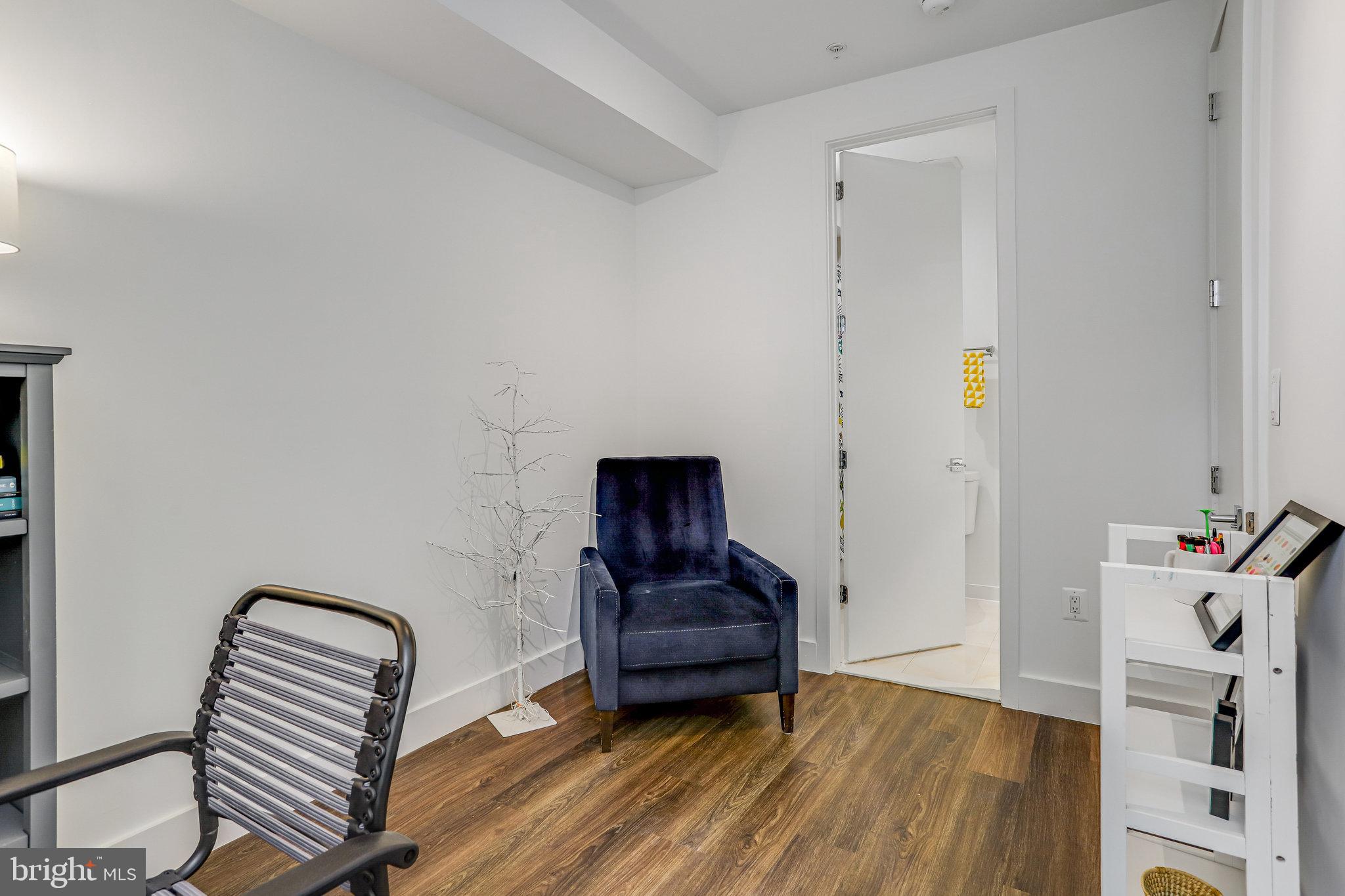 308 U Street Northeast, Unit 1 Washington, DC 20002 - Photo 16 of 25 a view of a hallway with wooden floor and furniture