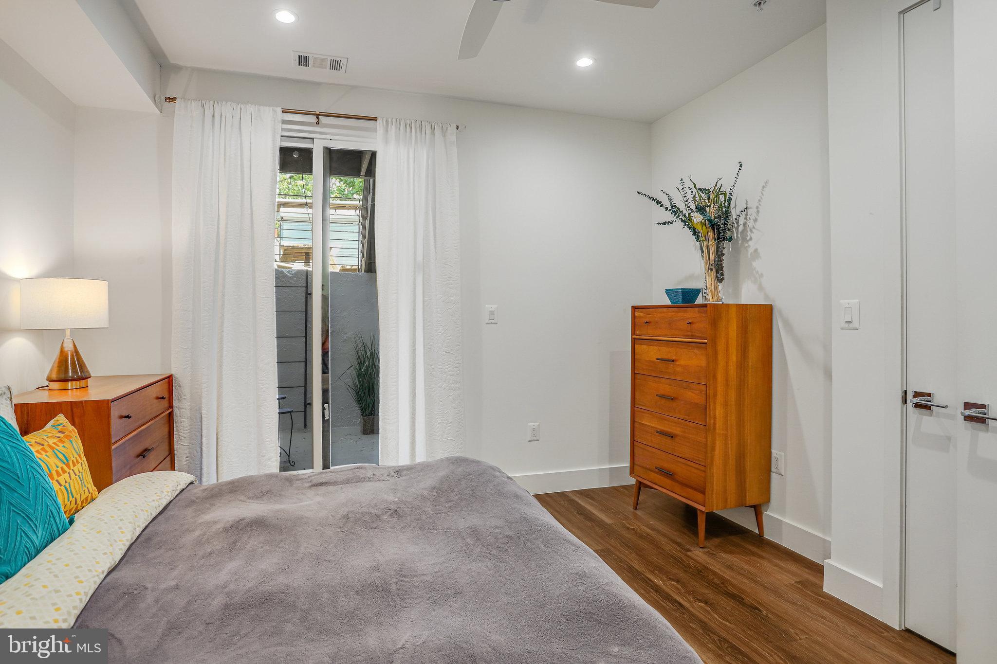 308 U Street Northeast, Unit 1 Washington, DC 20002 - Photo 19 of 25 a bedroom with a bed and a potted plant