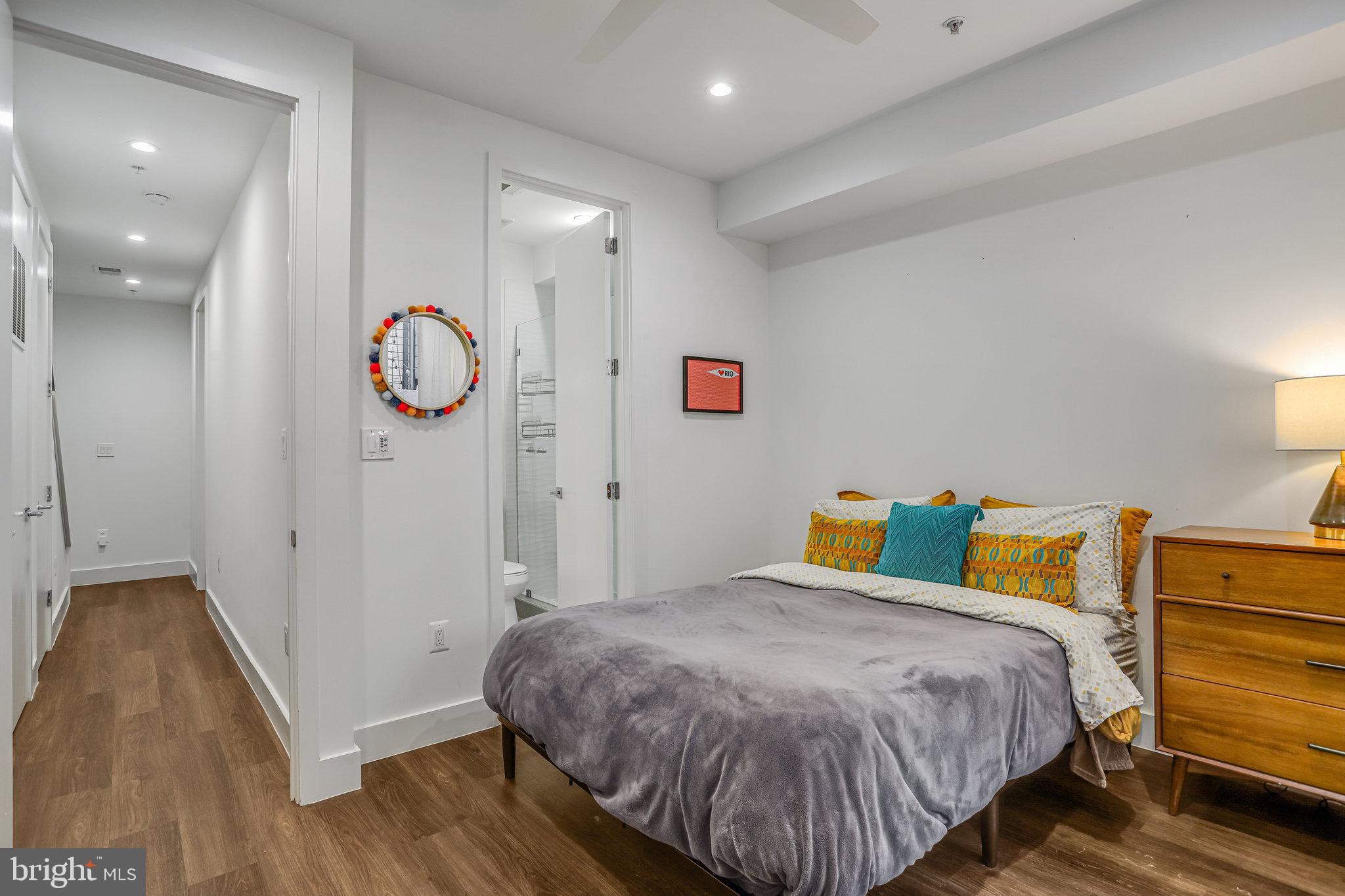 308 U Street Northeast, Unit 1 Washington, DC 20002 - Photo 20 of 25 a bedroom with a bed and a lamp