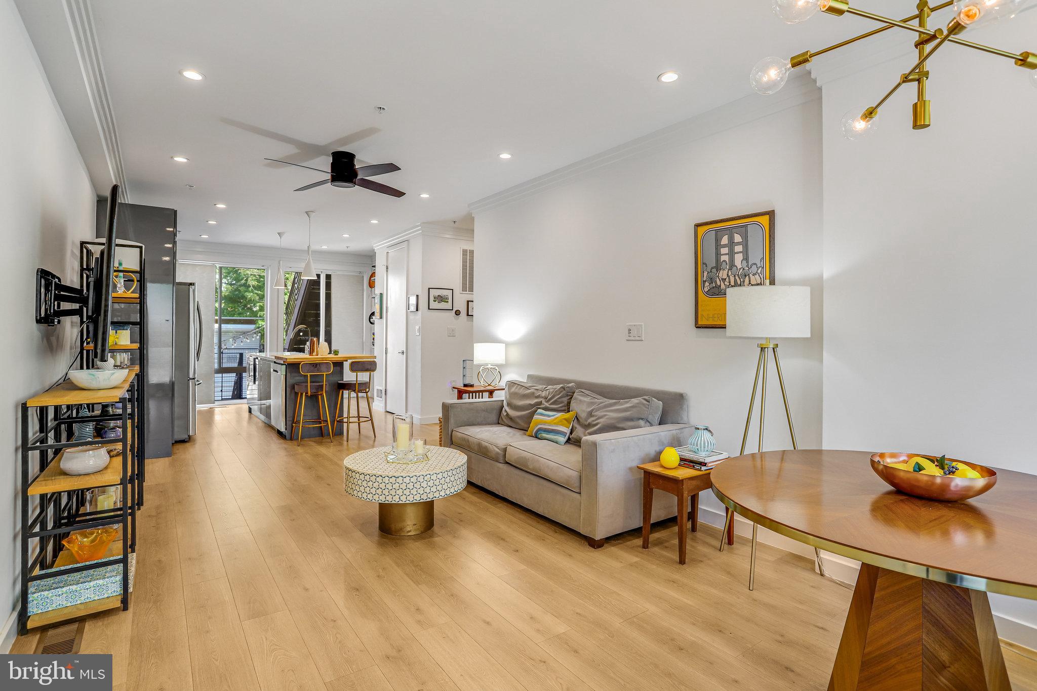 308 U Street Northeast, Unit 1 Washington, DC 20002 - Photo 2 of 25 a living room with furniture and a flat screen tv