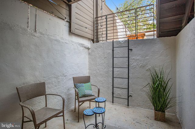 a view of a chairs and bench in the terrace