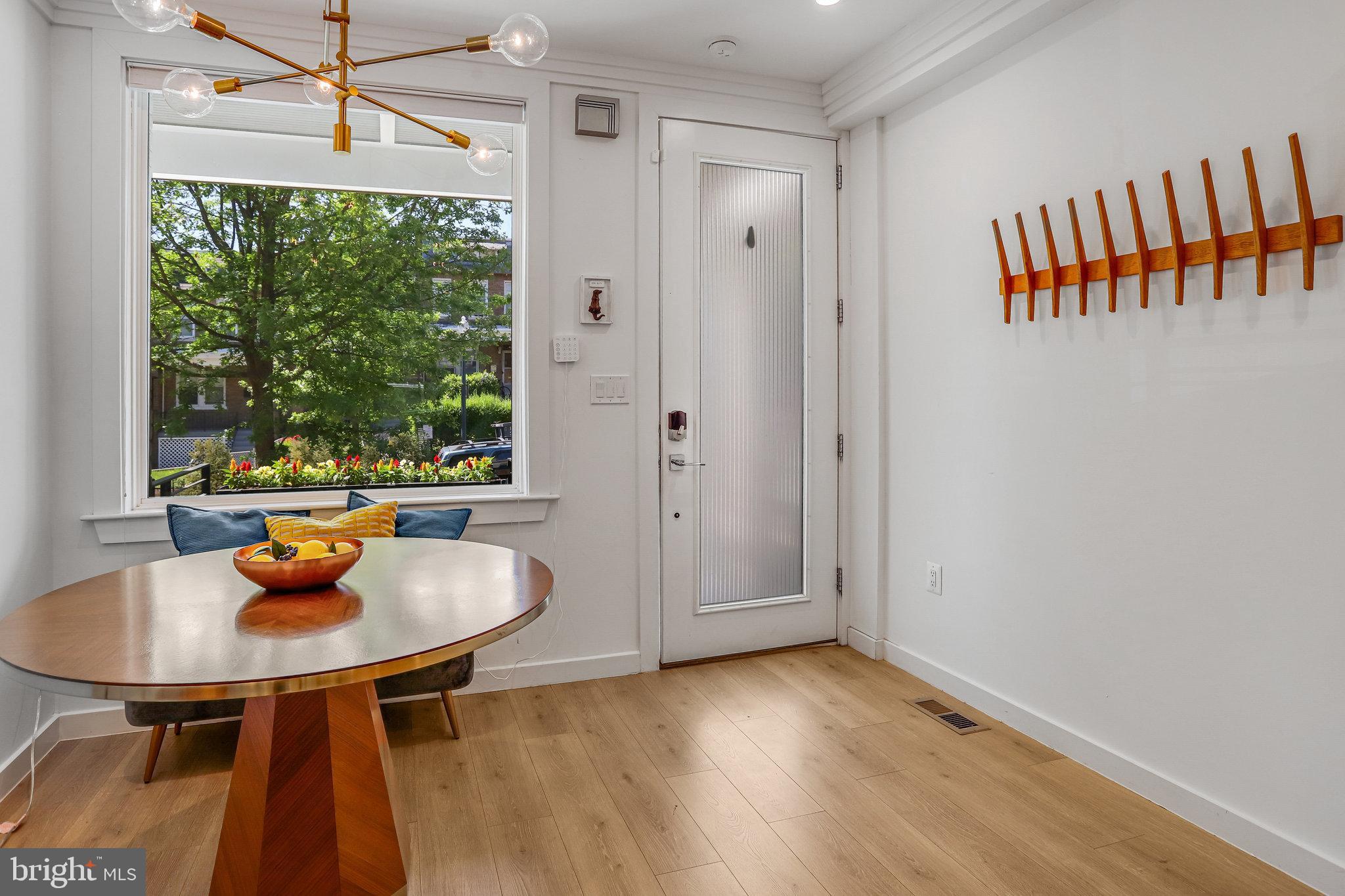 308 U Street Northeast, Unit 1 Washington, DC 20002 - Photo 4 of 25 a dining room with furniture and a window