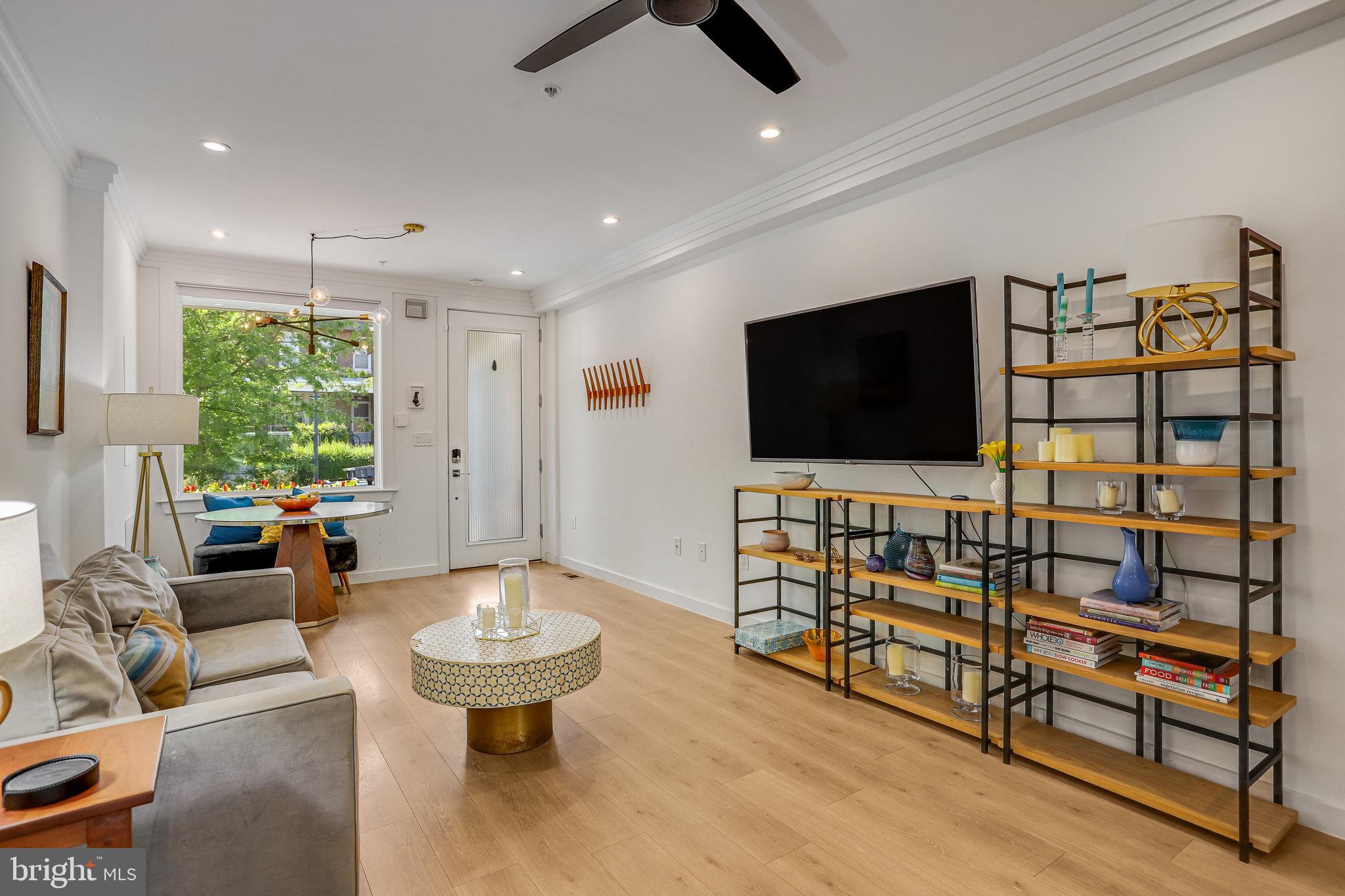 308 U Street Northeast, Unit 1 Washington, DC 20002 - Photo 5 of 25 a living room with furniture and a flat screen tv
