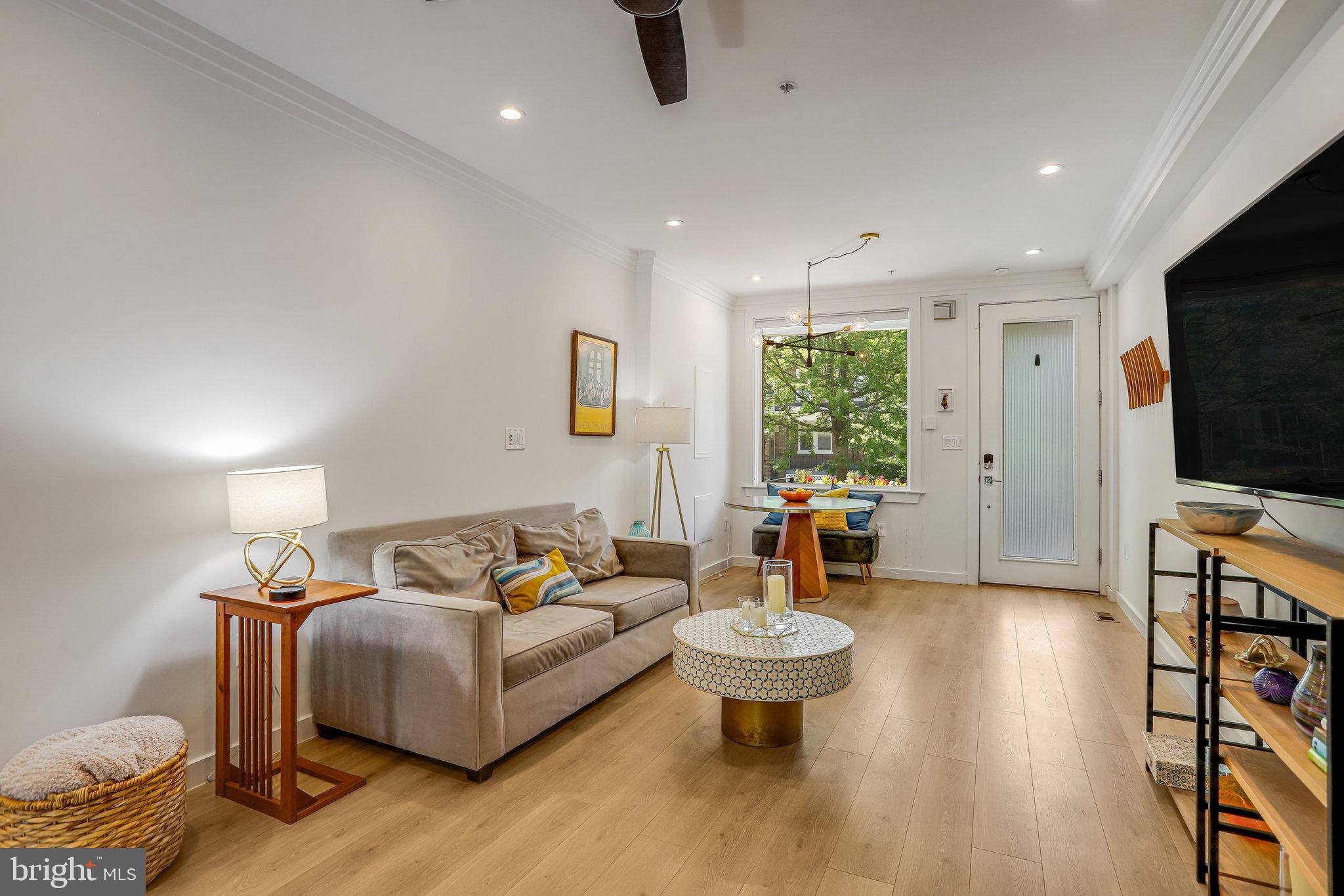 308 U Street Northeast, Unit 1 Washington, DC 20002 - Photo 7 of 25 a living room with furniture and a flat screen tv