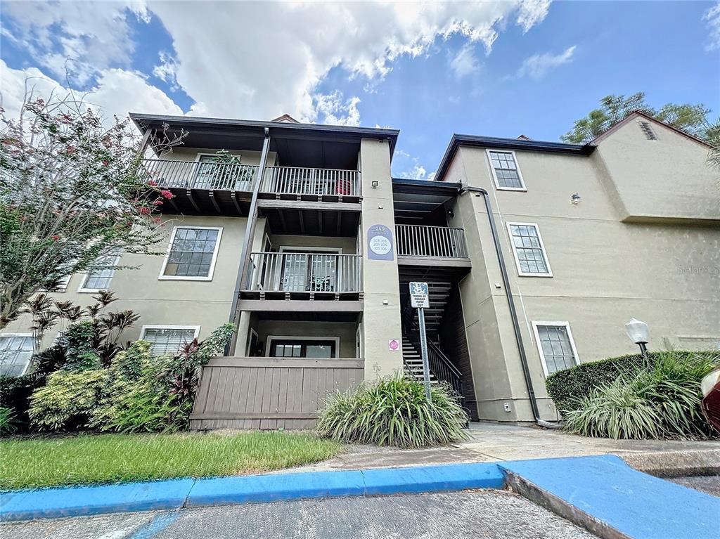 249 Afton Square, Unit 303 Altamonte Springs, FL 32714 - Photo 1 of 1 a front view of a house with a garden