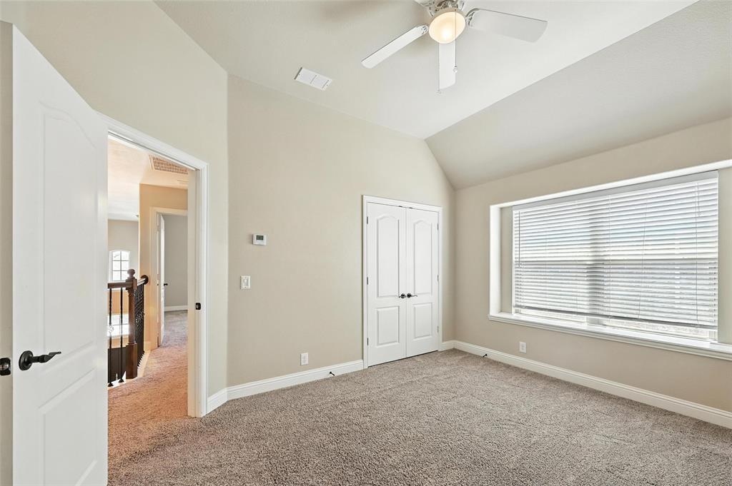 4203 Magnolia Road Melissa, TX 75454 - Photo 15 of 20 Unfurnished bedroom with light colored carpet, vaulted ceiling, ceiling fan, and a closet