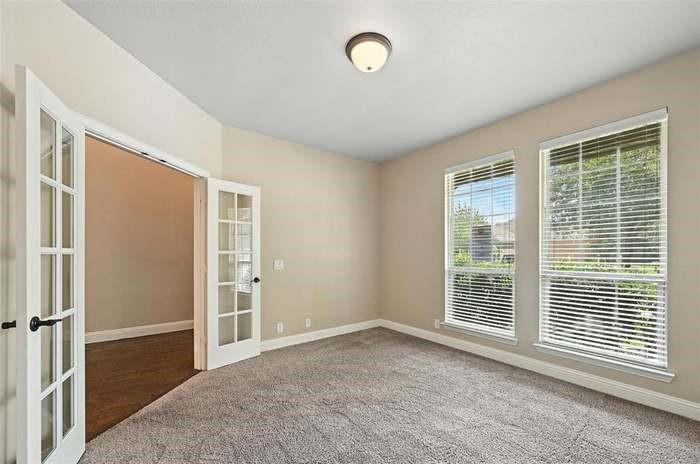 4203 Magnolia Road Melissa, TX 75454 - Photo 3 of 20 Carpeted empty room with french doors