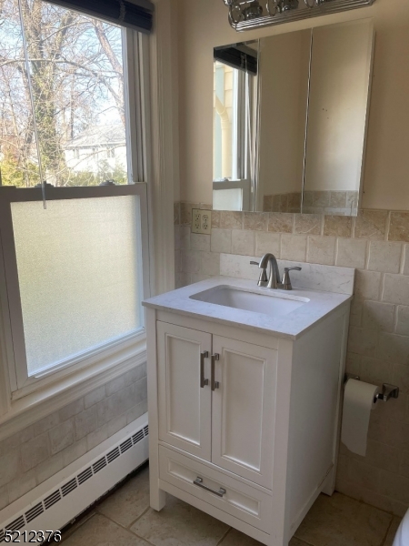 273 Edwards Street Ridgewood, NJ 07450 - Photo 17 of 26 a bathroom with a sink and a mirror