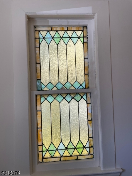 273 Edwards Street Ridgewood, NJ 07450 - Photo 2 of 26 a room with a wooden floor and a wall painting