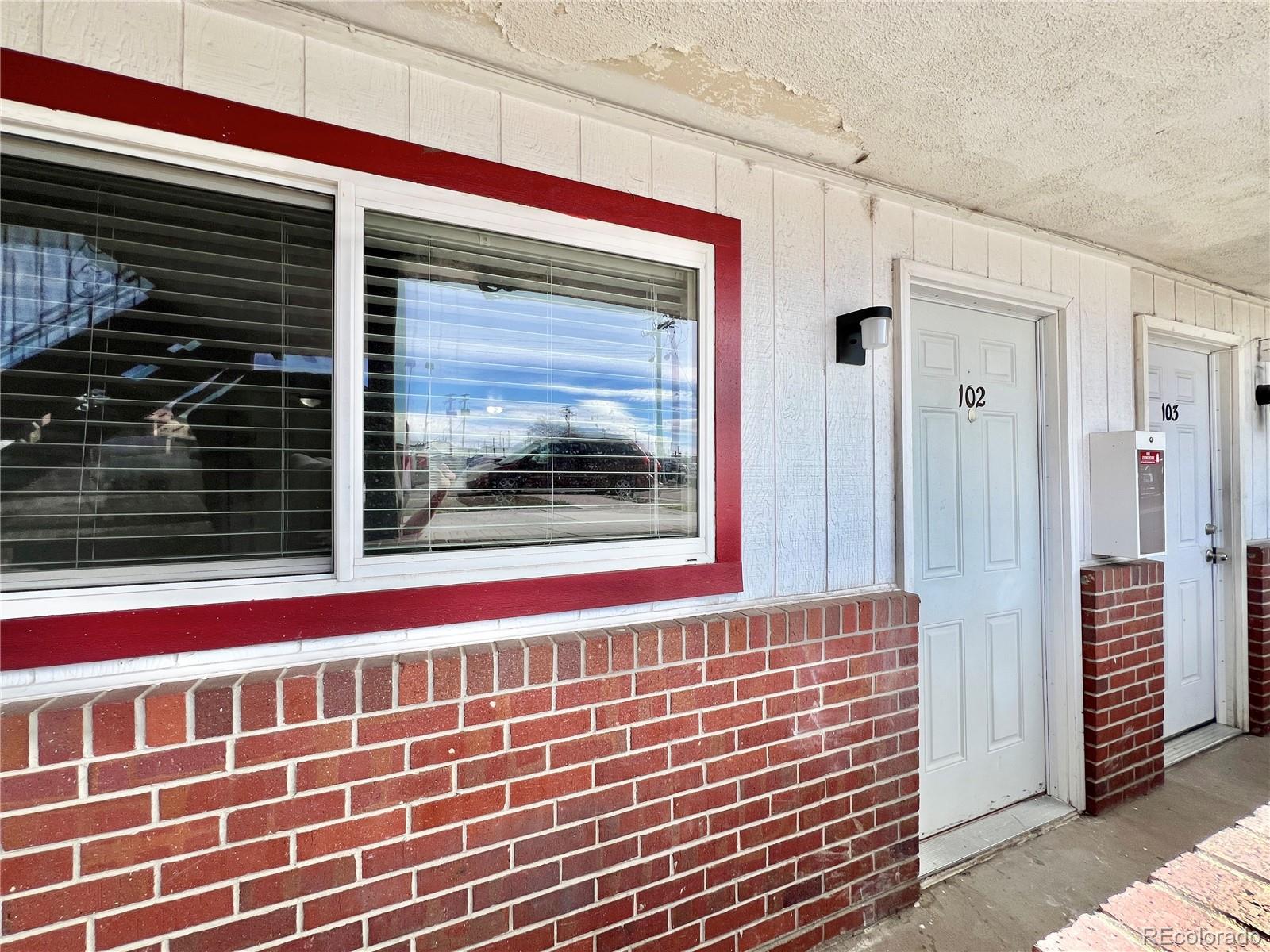 1090 South Eliot Street, Unit 102 Denver, CO 80219 - Photo 3 of 12 a view of front door of house