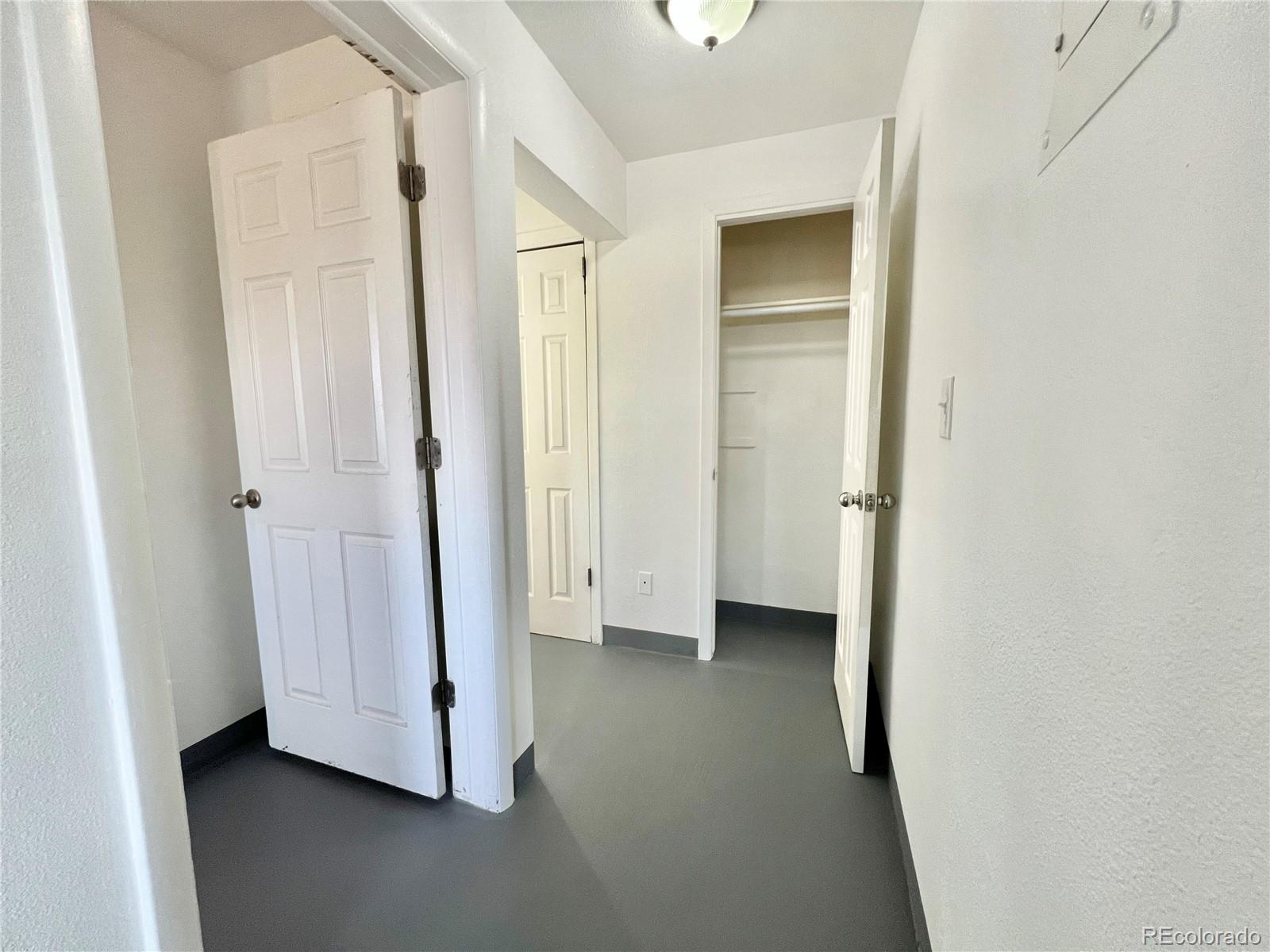 1090 South Eliot Street, Unit 102 Denver, CO 80219 - Photo 8 of 12 a view of an empty room with closet