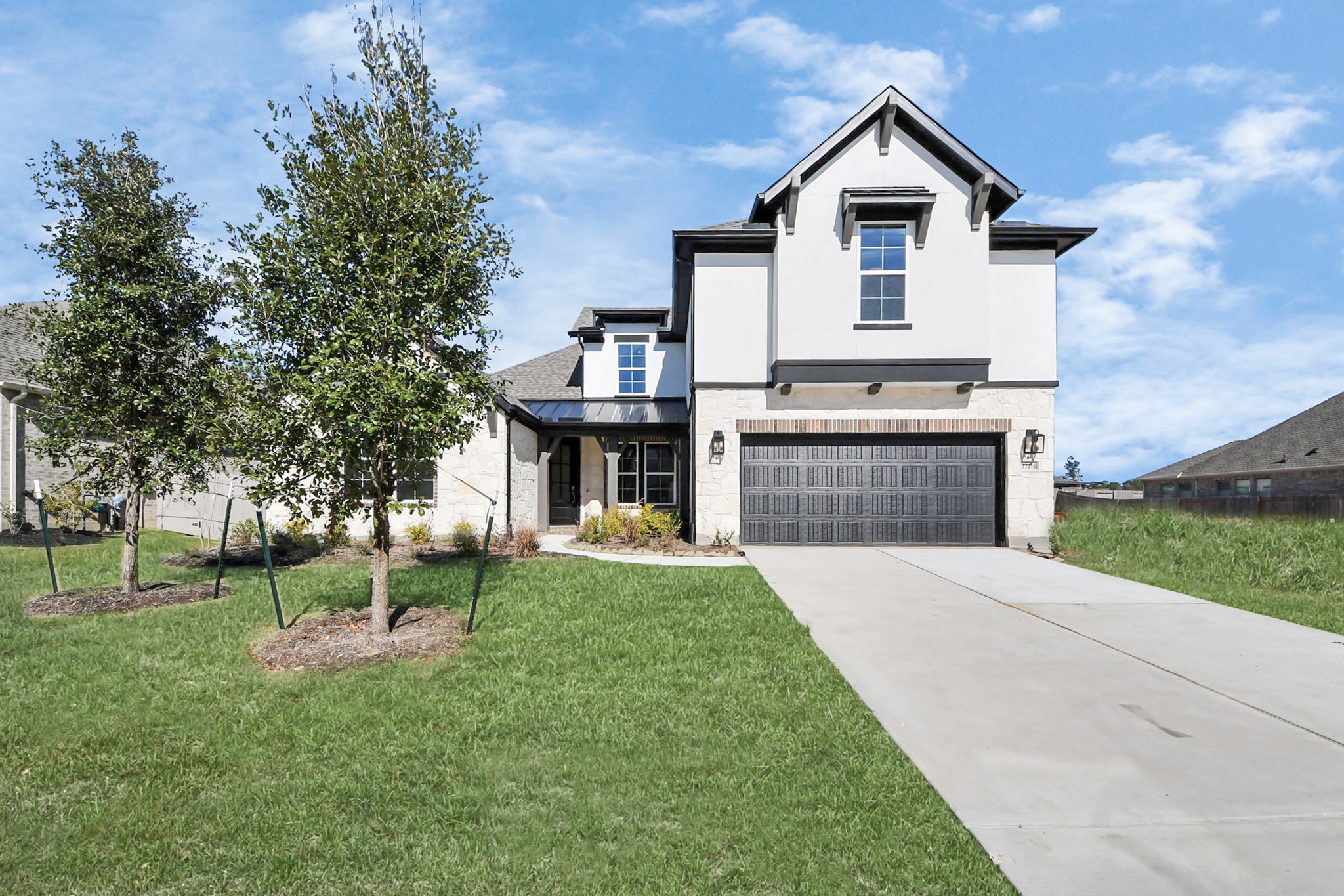 17315 July Moon Lane Conroe, TX 77302 - Photo 1 of 50 a front view of house with yard and green space