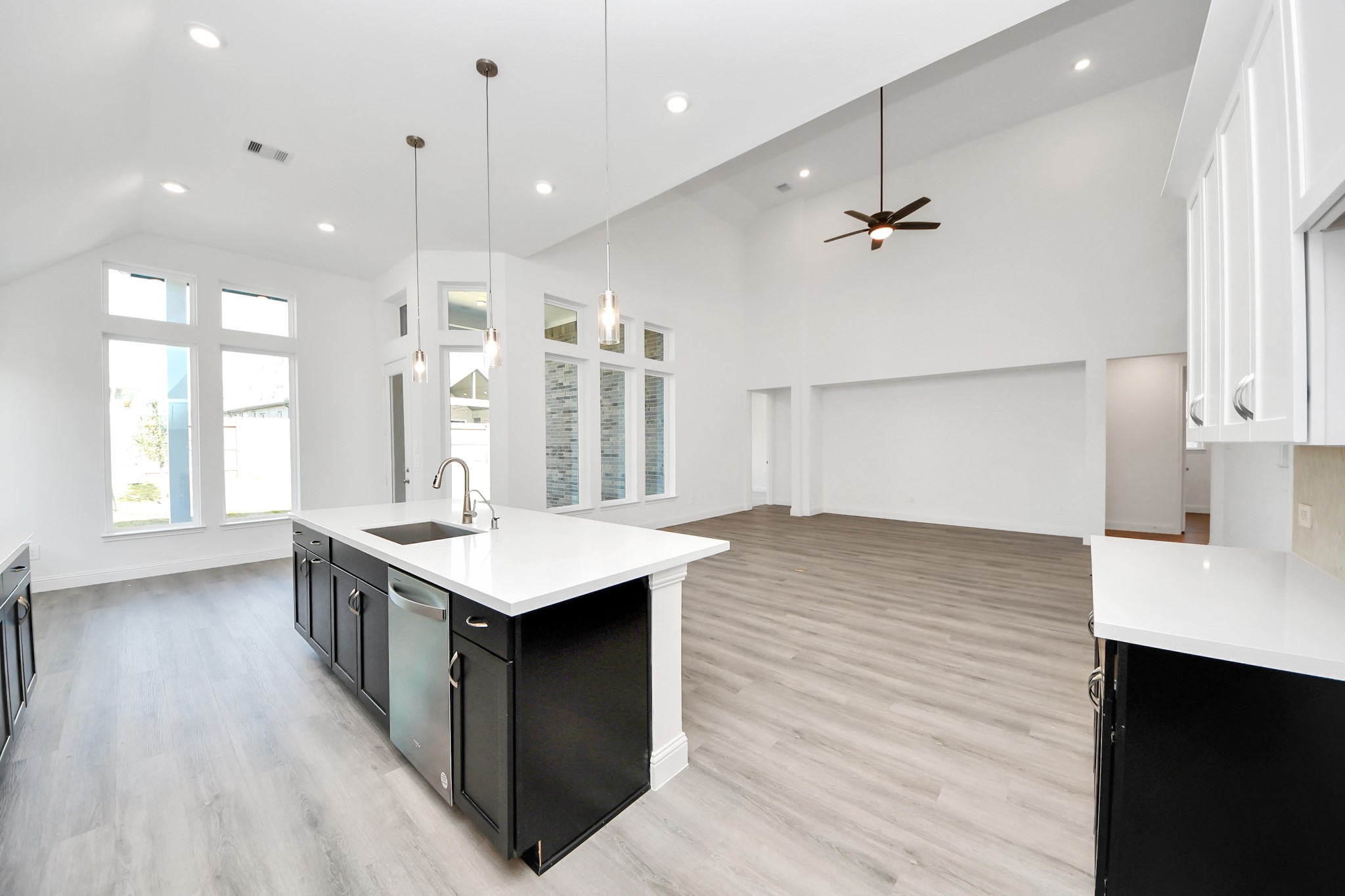 17315 July Moon Lane Conroe, TX 77302 - Photo 24 of 50 a kitchen with a stove and a wooden floor