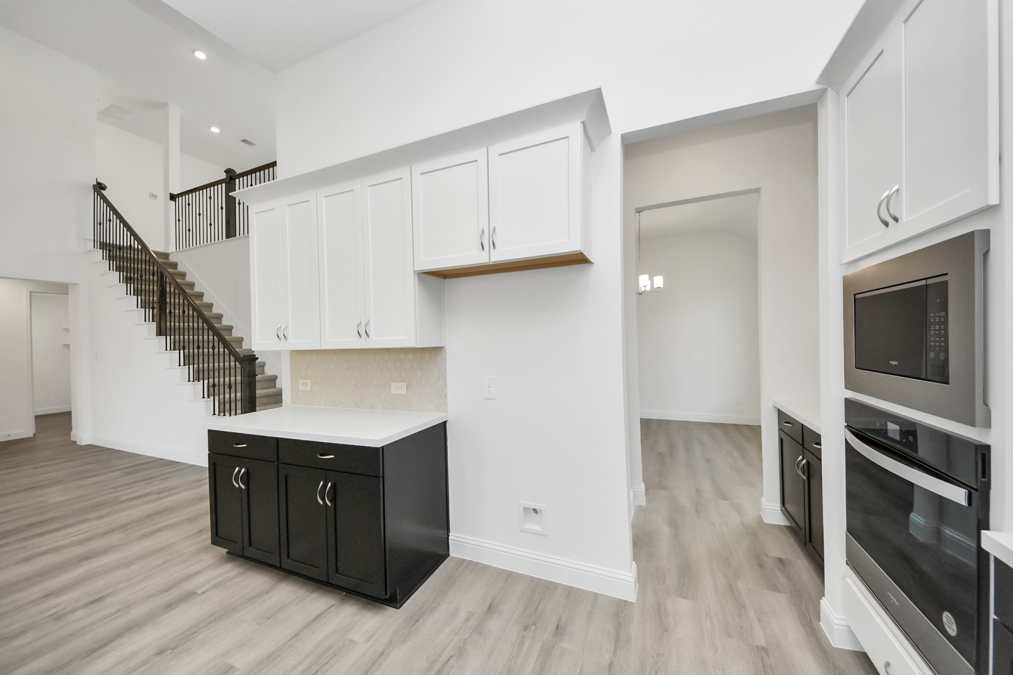 17315 July Moon Lane Conroe, TX 77302 - Photo 25 of 50 a kitchen with a refrigerator and a stove top oven