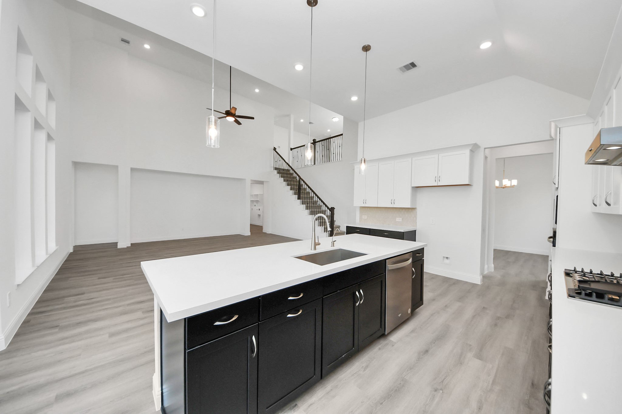 17315 July Moon Lane Conroe, TX 77302 - Photo 27 of 50 a kitchen with a sink a stove and a refrigerator