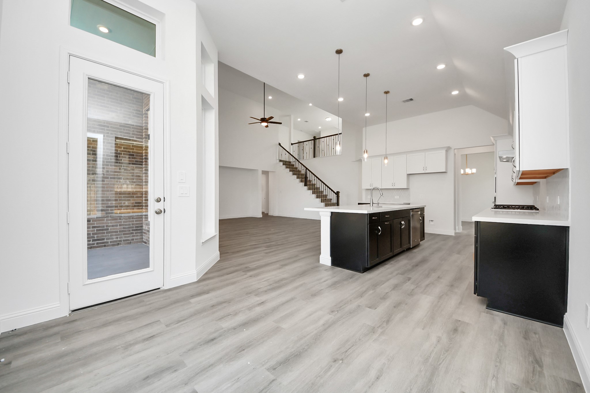 17315 July Moon Lane Conroe, TX 77302 - Photo 32 of 50 a living room with wooden floor and furniture