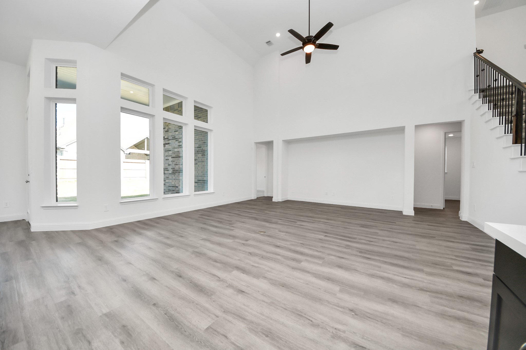 17315 July Moon Lane Conroe, TX 77302 - Photo 34 of 50 a view of empty room with wooden floor and fan