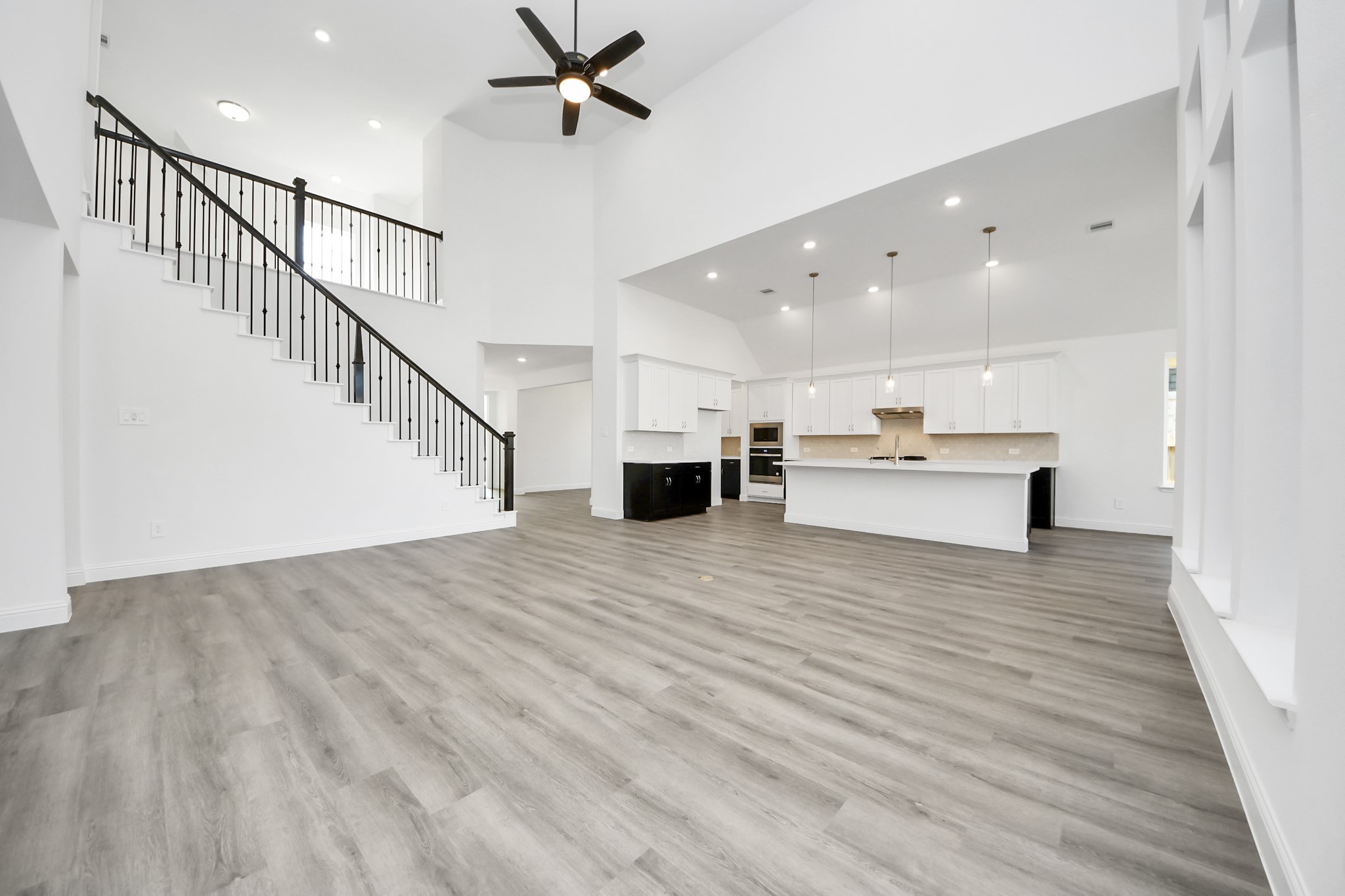 17315 July Moon Lane Conroe, TX 77302 - Photo 36 of 50 a view of a hallway with wooden floor and staircase