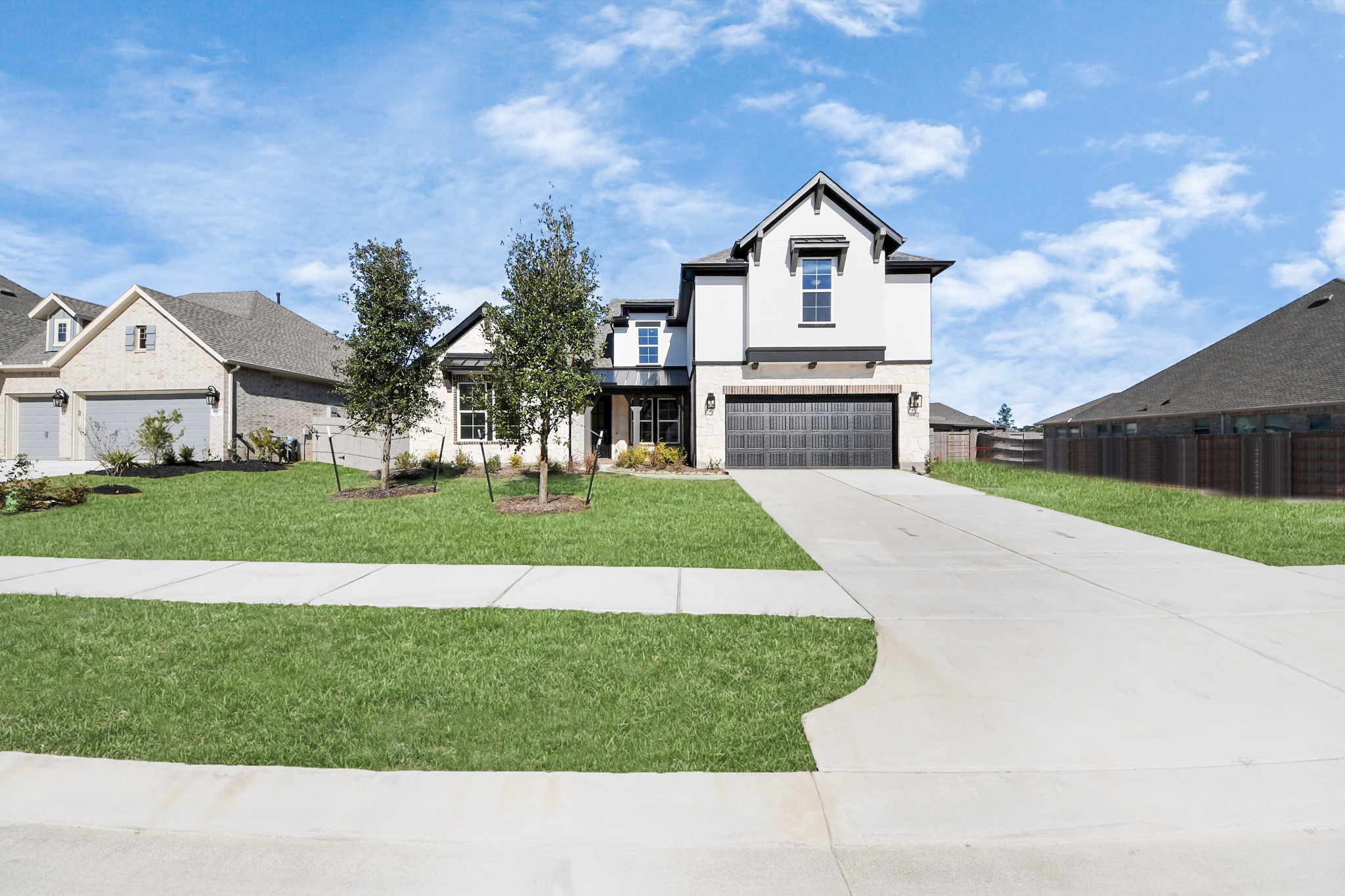 17315 July Moon Lane Conroe, TX 77302 - Photo 4 of 50 a view of house with garden and tall tress