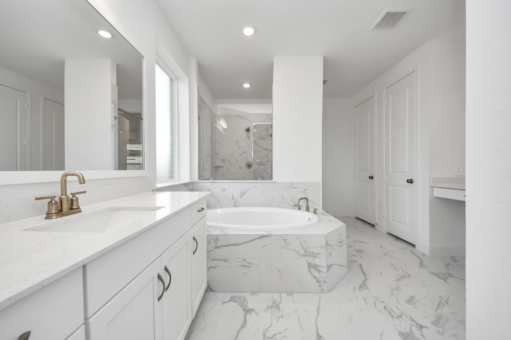 17315 July Moon Lane Conroe, TX 77302 - Photo 46 of 50 a bathroom with a sink a toilet and mirror