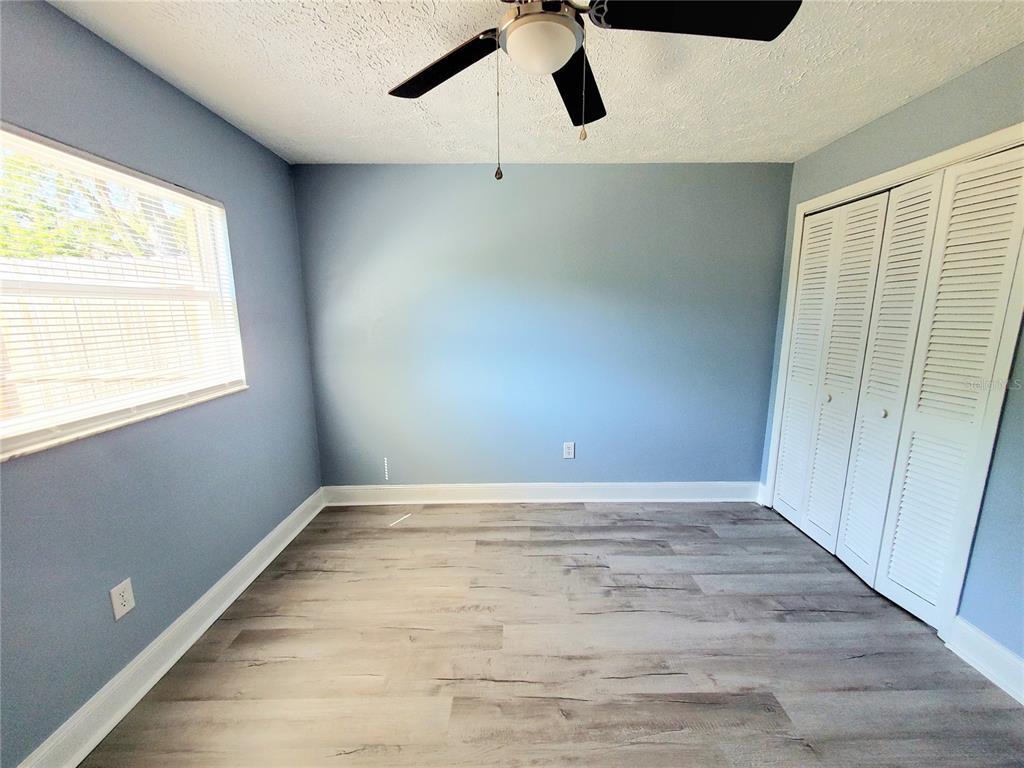 5838 Sun Glo Avenue Port Richey, FL 34668 - Photo 12 of 19 a view of an empty room with a window