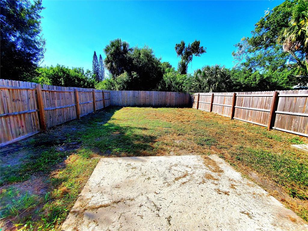 5838 Sun Glo Avenue Port Richey, FL 34668 - Photo 14 of 19 a view of backyard with green space