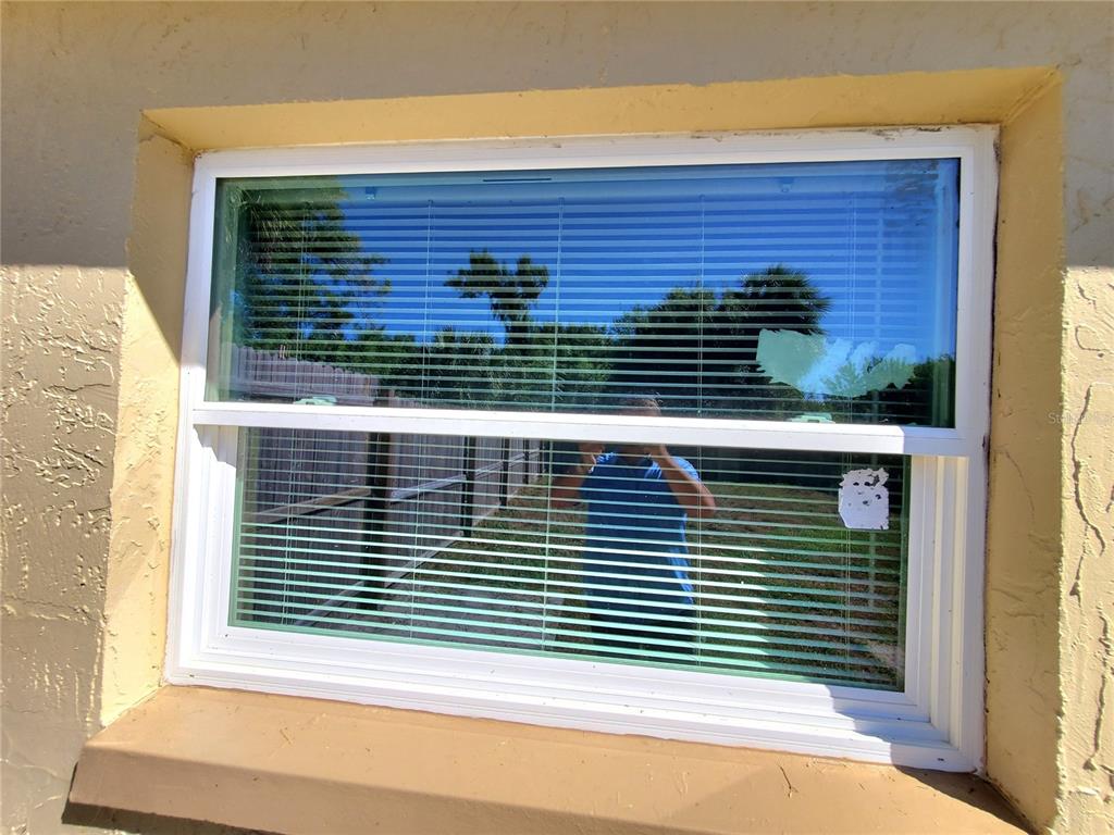 5838 Sun Glo Avenue Port Richey, FL 34668 - Photo 17 of 19 a view of a balcony and a window