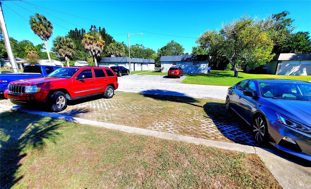 5838 Sun Glo Avenue Port Richey, FL 34668 - Photo 3 of 19 a view of a yard with furniture and a fire pit