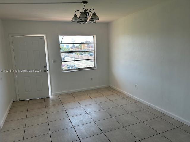 Grapeland Heights Miami, FL 33125 - Photo 2 of 7 a view of an empty room with a window