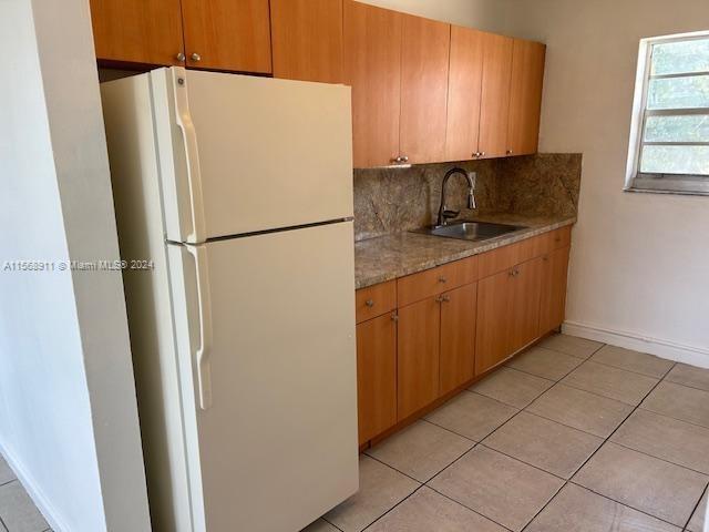 Grapeland Heights Miami, FL 33125 - Photo 6 of 7 a white refrigerator freezer sitting in a kitchen