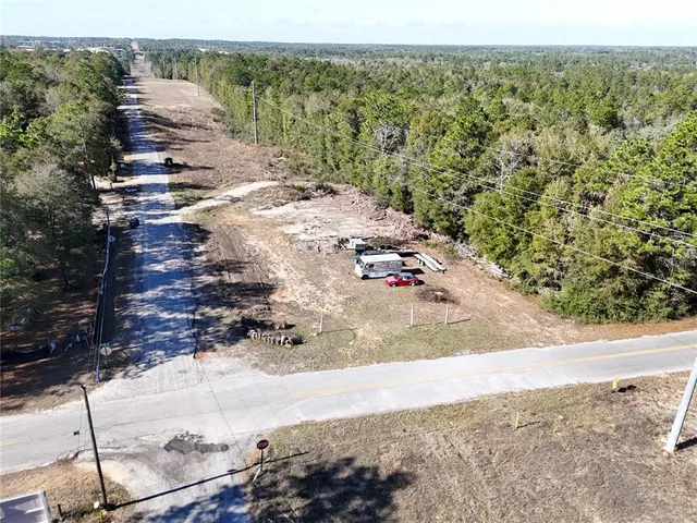 a view of a yard with an ocean view
