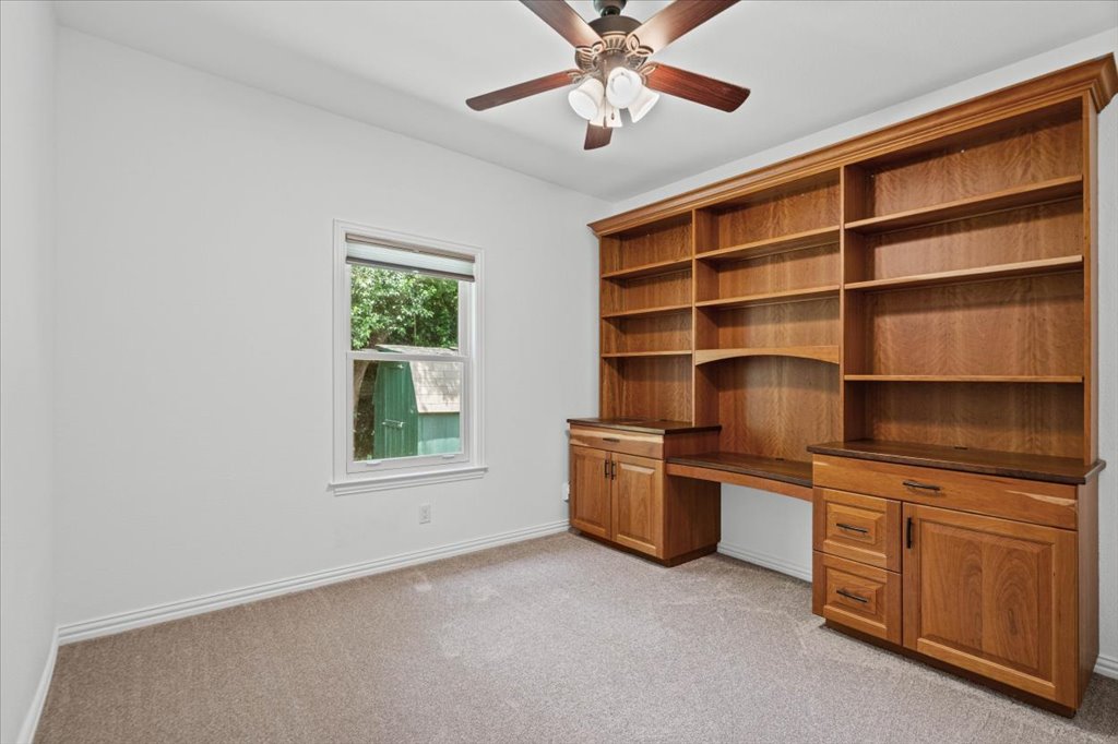 37 Pillow Road Austin, TX 78745 - Photo 14 of 18 Integrated wooden cabinetry and shelving offer extensive storage within this versatile room.