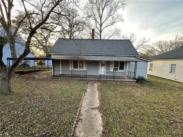front view of a house with a tiny house