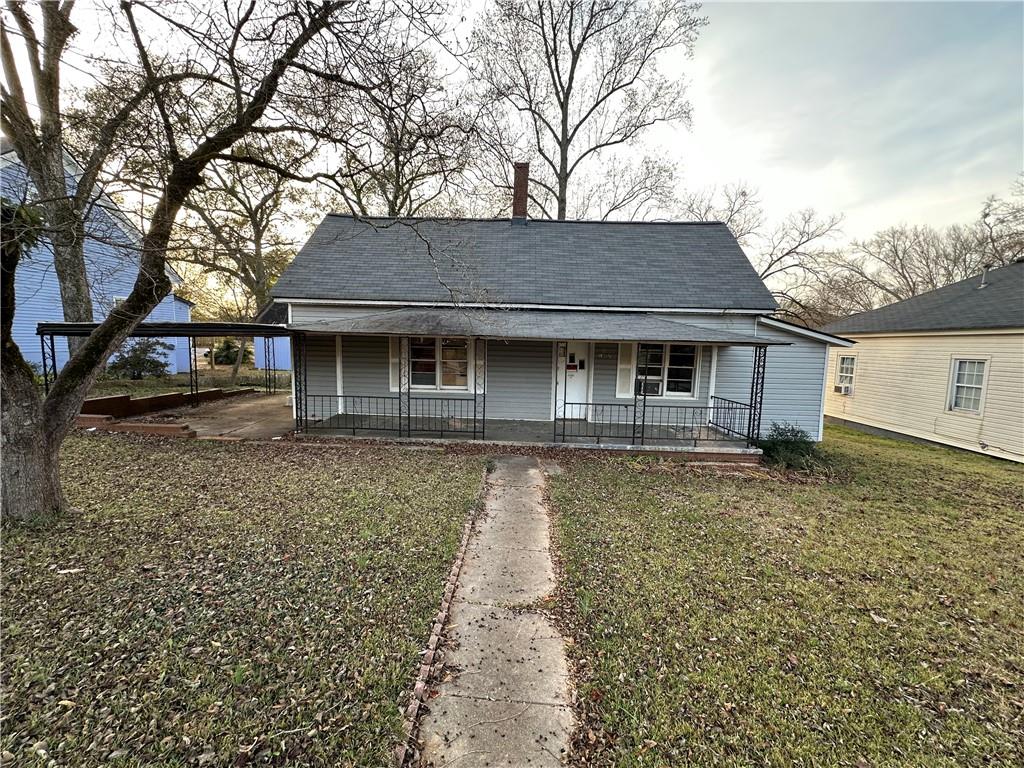 10 Elm Street Covington, GA 30014 - Photo 1 of 14 front view of a house with a tiny house