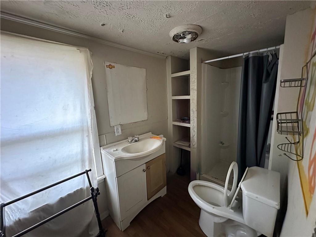 10 Elm Street Covington, GA 30014 - Photo 11 of 14 a bathroom with a sink a toilet and shower