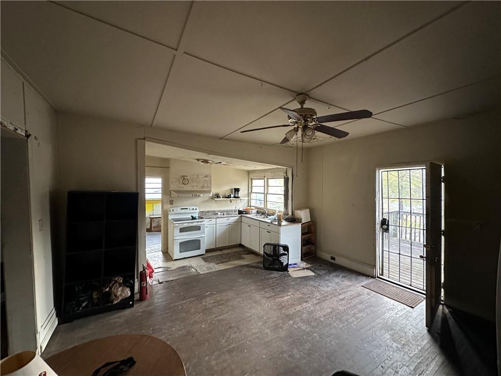 10 Elm Street Covington, GA 30014 - Photo 12 of 14 a view of a livingroom with furniture window and a kitchen