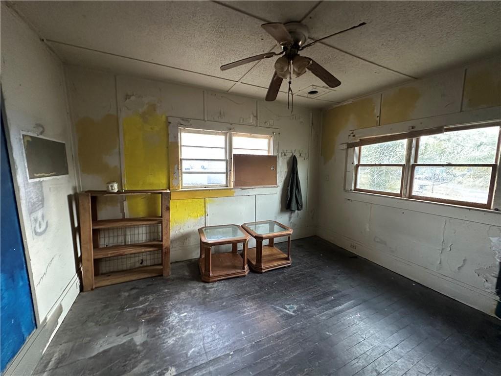 10 Elm Street Covington, GA 30014 - Photo 7 of 14 wooden floor in an empty room with a window