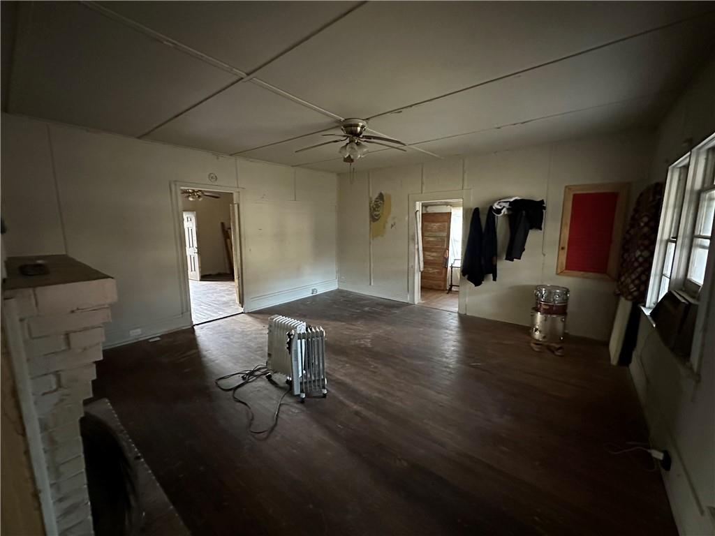 10 Elm Street Covington, GA 30014 - Photo 10 of 14 a view of a workspace with furniture and wooden floor