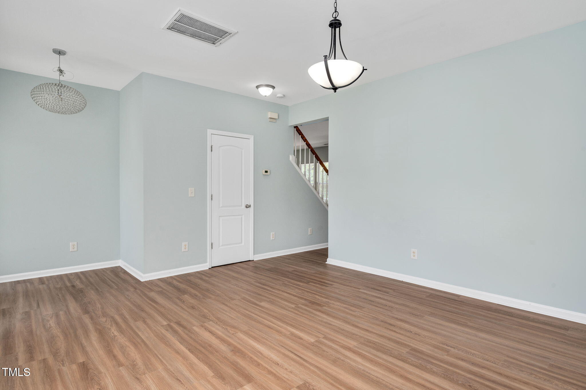 3805 Mike Levi Court Raleigh, NC 27610 - Photo 11 of 34 a view of an empty room with wooden floor
